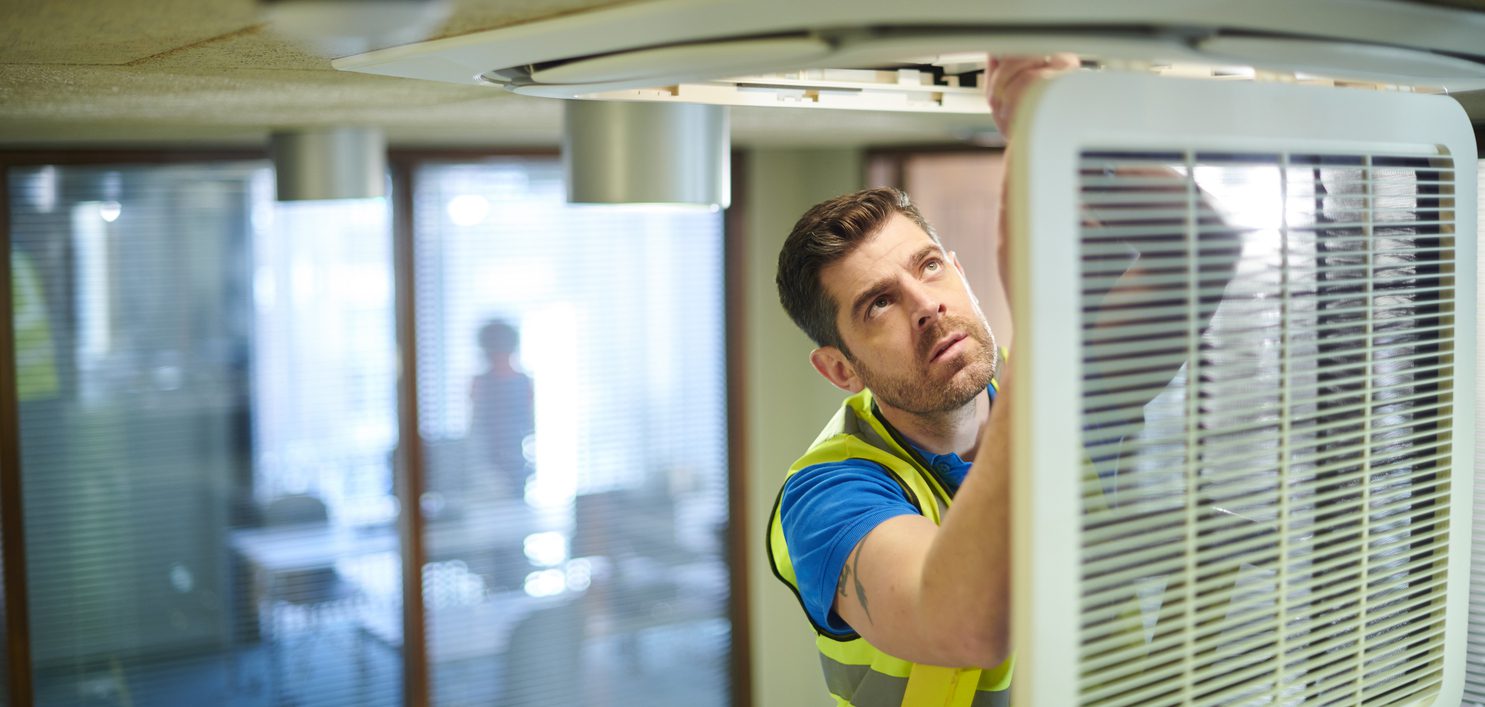 air con engineer in an office air con engineer in an office
